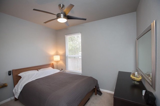 bedroom with light carpet and ceiling fan