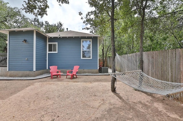 rear view of property featuring cooling unit