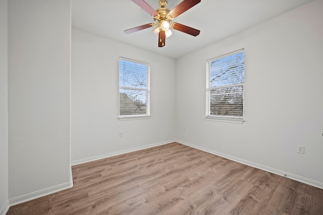 unfurnished room featuring ceiling fan and light hardwood / wood-style flooring