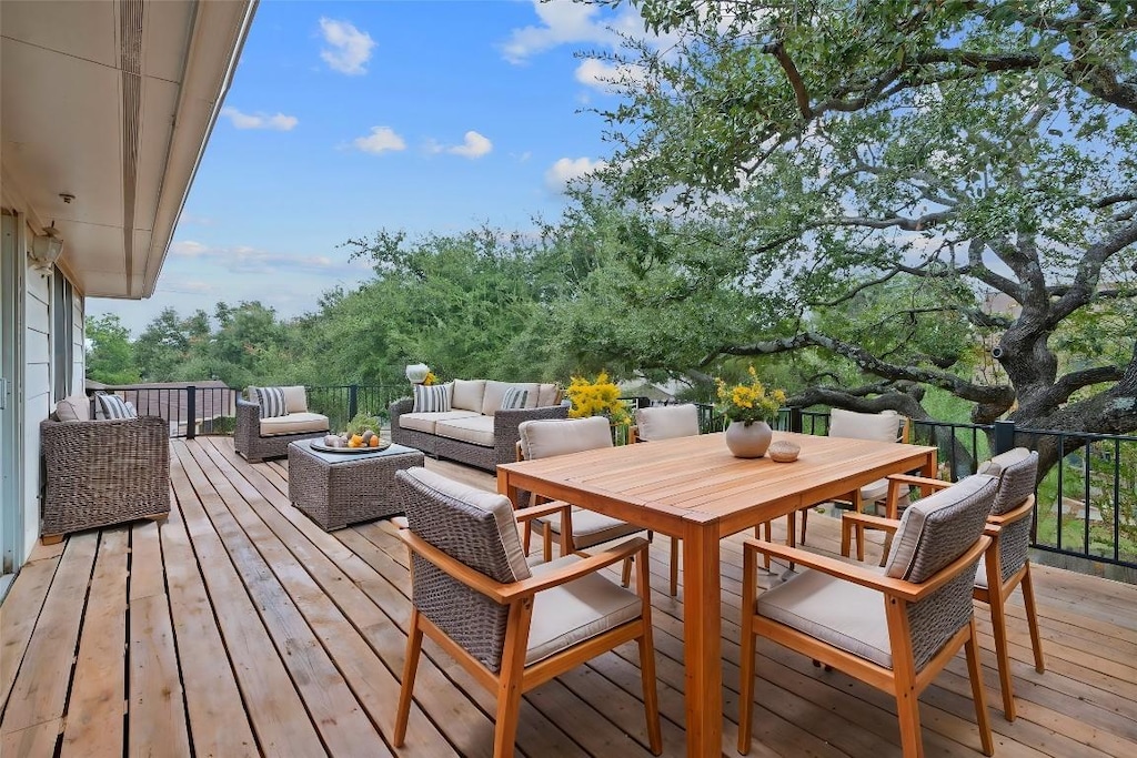 wooden terrace featuring an outdoor hangout area