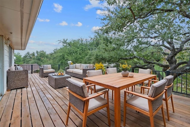 wooden terrace featuring an outdoor hangout area