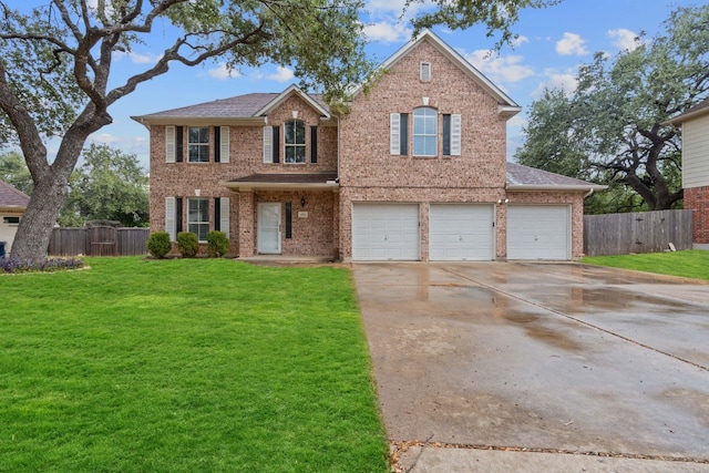 view of front facade featuring a garage and a front yard