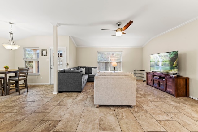 living room with ceiling fan, a healthy amount of sunlight, ornamental molding, and vaulted ceiling