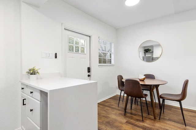 dining area featuring dark hardwood / wood-style floors