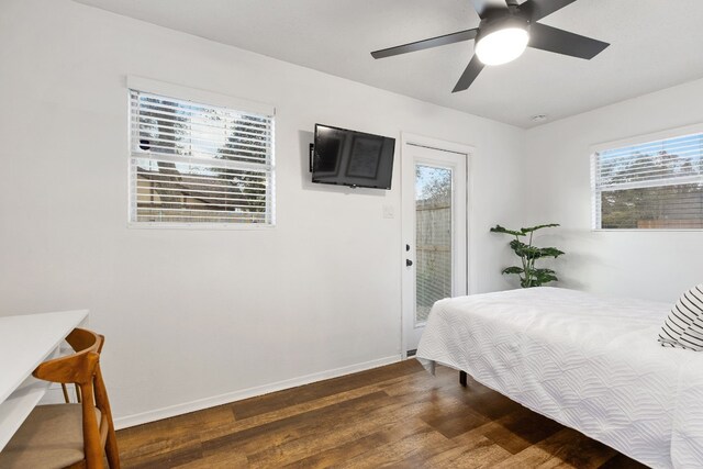 bedroom with ceiling fan, access to outside, and dark hardwood / wood-style flooring