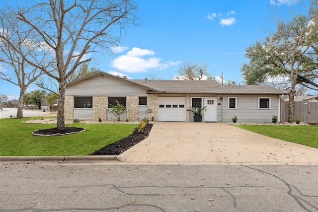 view of front facade with a garage and a front lawn