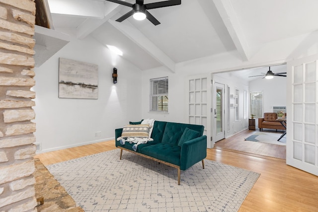 sitting room with lofted ceiling with beams, ceiling fan, and wood finished floors