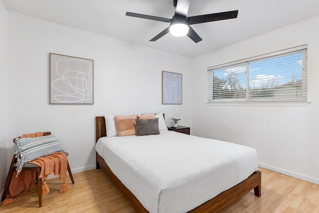 bedroom featuring hardwood / wood-style flooring and ceiling fan