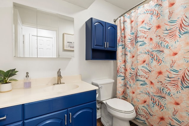 bathroom featuring vanity, toilet, and a shower with shower curtain