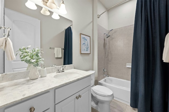 full bathroom featuring vanity, tile patterned flooring, toilet, and shower / bath combo