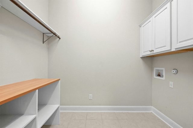259 N Sage Holw, Dripping Springs, TX 78620 - laundry room with cabinet space, baseboards, hookup for a washing machine, and light tile patterned floors