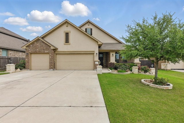 259 N Sage Holw, Dripping Springs, TX 78620 - view of front facade featuring an attached garage, stucco siding, driveway, and brick siding
