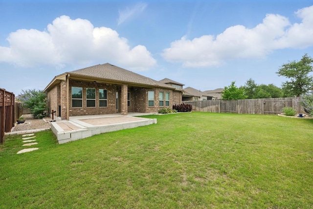 259 N Sage Holw, Dripping Springs, TX 78620 - back of property featuring a patio and brick siding