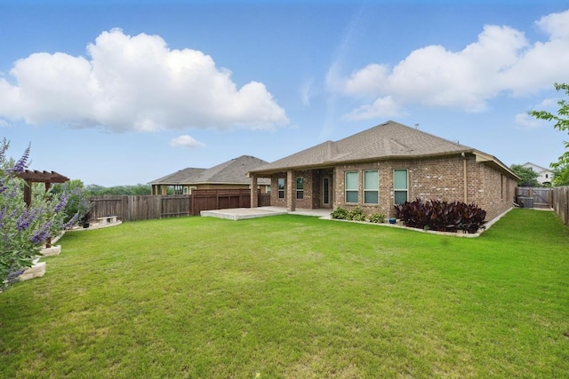 259 N Sage Holw, Dripping Springs, TX 78620 - back of property featuring a patio, a fenced backyard, and brick siding