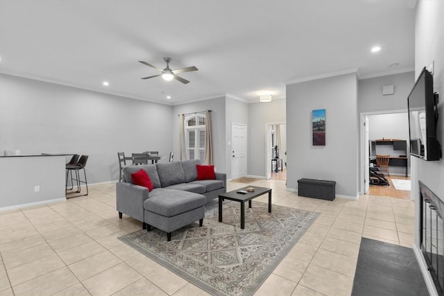 tiled living room featuring ornamental molding and ceiling fan