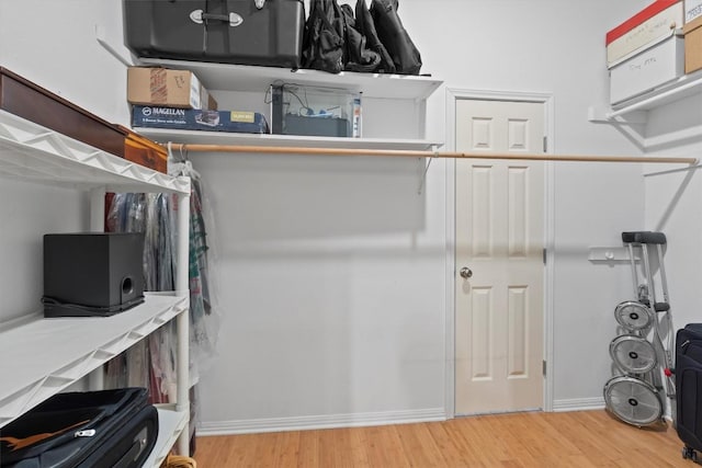 walk in closet featuring hardwood / wood-style floors