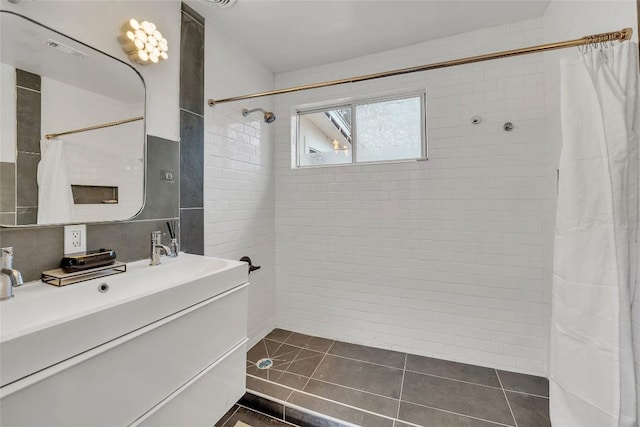 bathroom featuring tile patterned flooring, vanity, and a shower with shower curtain