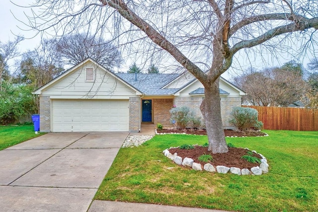 ranch-style house featuring a garage and a front yard