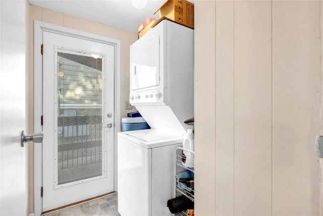 laundry area with stacked washer and dryer