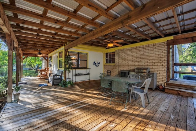 wooden terrace with grilling area and ceiling fan