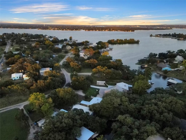 aerial view at dusk with a water view