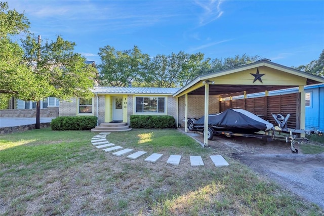 ranch-style home with a front lawn and a carport