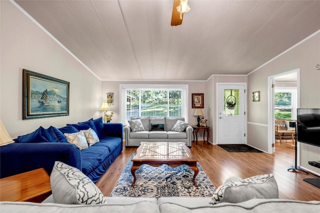 living room with lofted ceiling, hardwood / wood-style floors, crown molding, and wood ceiling