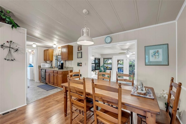 dining room featuring ceiling fan and light hardwood / wood-style flooring