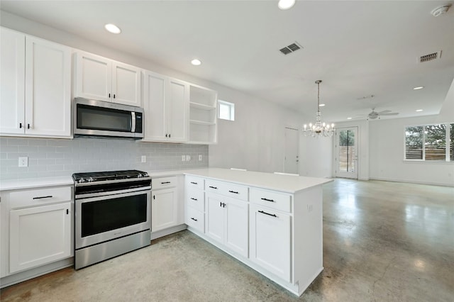 kitchen featuring visible vents, finished concrete floors, light countertops, a peninsula, and stainless steel appliances