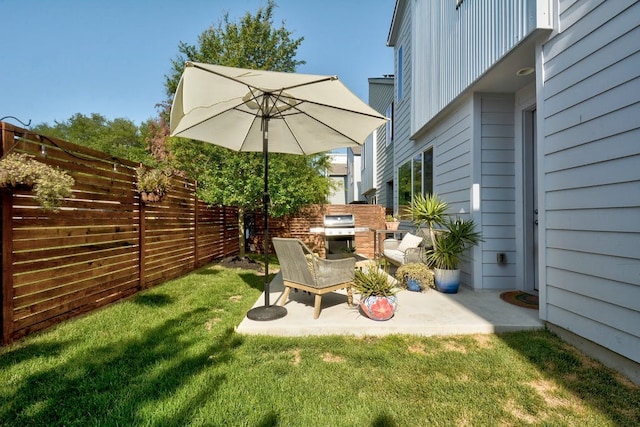 view of yard with a patio and fence