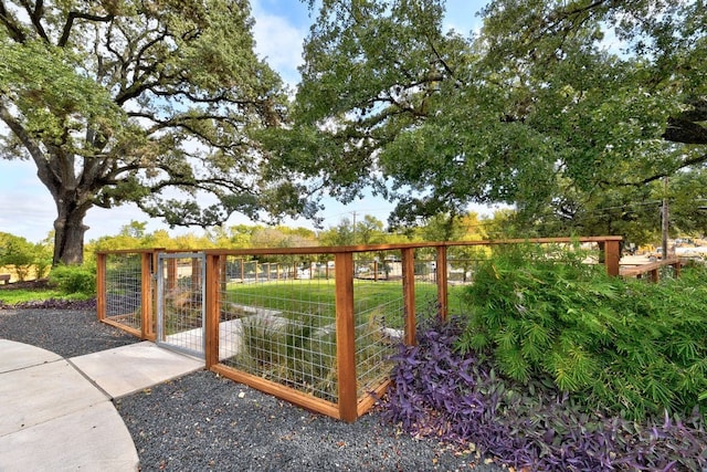 view of gate featuring an outbuilding