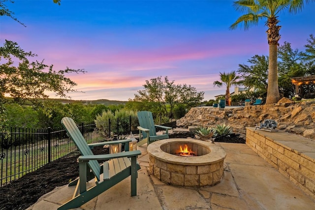 patio terrace at dusk with an outdoor fire pit