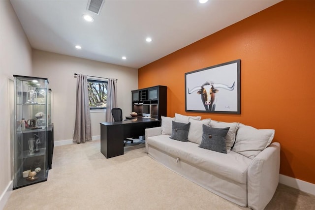 home office with recessed lighting, visible vents, light carpet, and baseboards