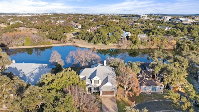 drone / aerial view with a water view and a residential view