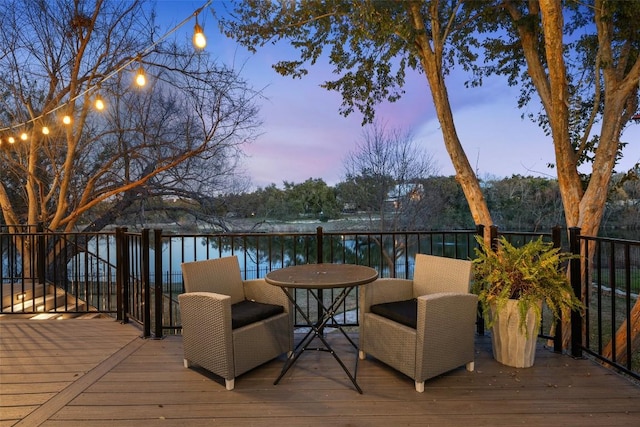 wooden terrace with a water view