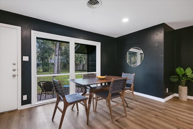 dining room with hardwood / wood-style flooring