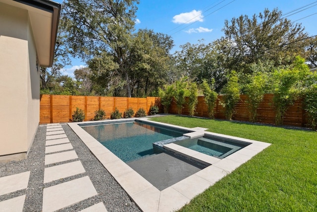 view of pool with an in ground hot tub and a lawn