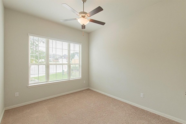 carpeted empty room with ceiling fan