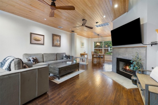 living room featuring wood ceiling, ceiling fan, dark hardwood / wood-style flooring, and crown molding