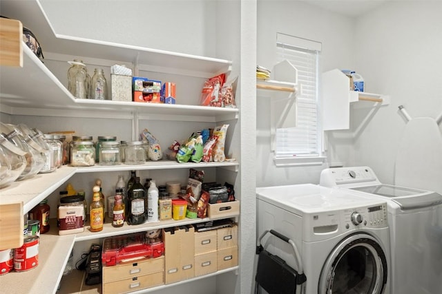 laundry room with separate washer and dryer