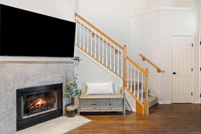 stairs featuring hardwood / wood-style floors