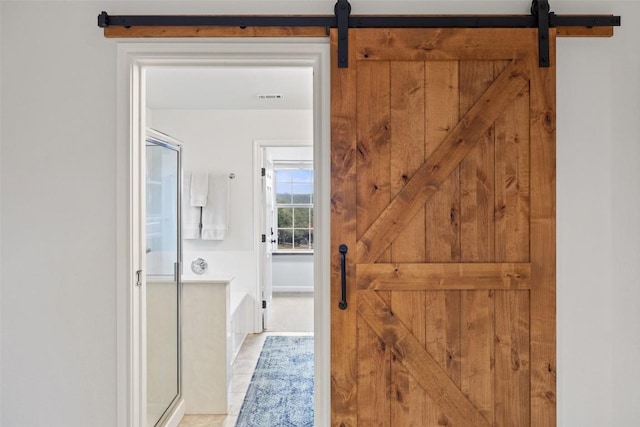 bathroom with tile patterned floors