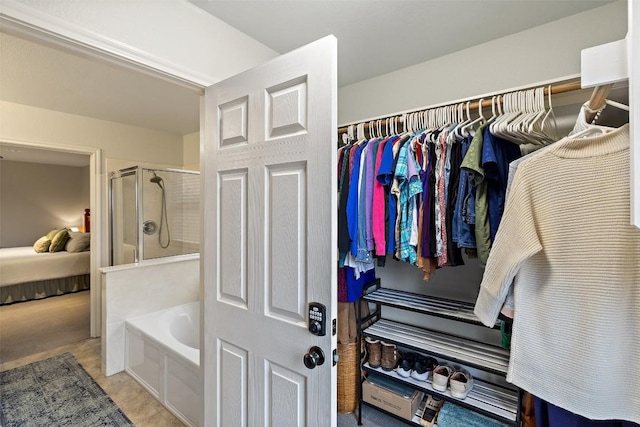 bathroom featuring independent shower and bath