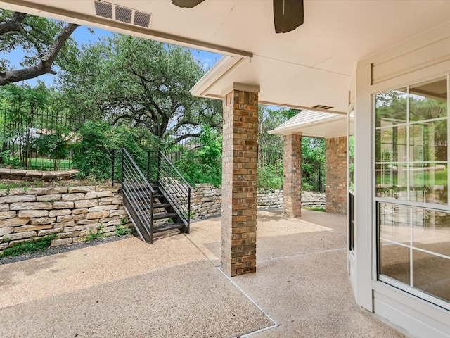 view of patio featuring ceiling fan