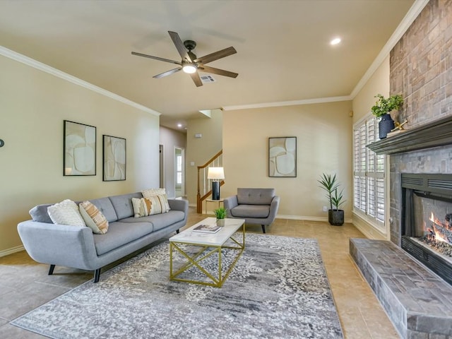 living room with light tile patterned floors, crown molding, a large fireplace, and a healthy amount of sunlight