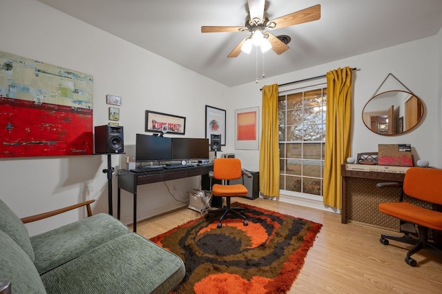 office area with ceiling fan and light hardwood / wood-style floors