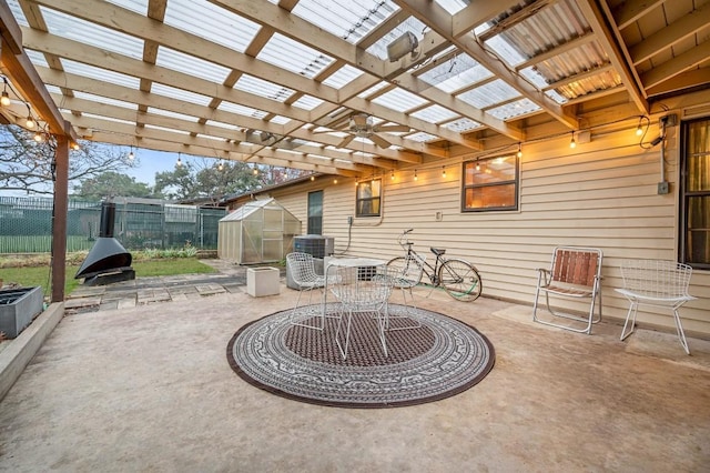 view of patio / terrace with an outbuilding and a pergola