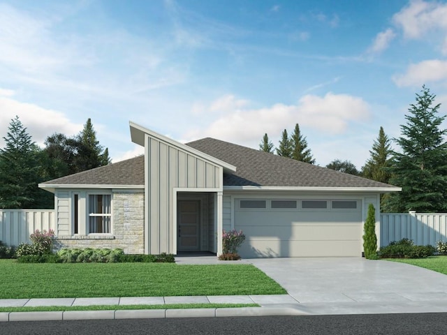 view of front of home with a garage and a front lawn