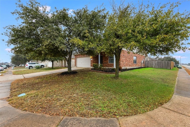 view of front of property featuring a garage and a front yard