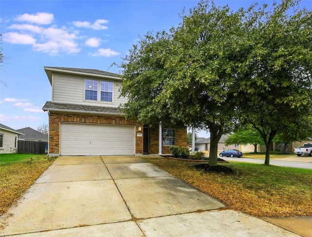 view of front of home featuring a garage and a front yard